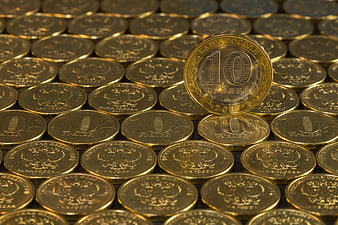 Stacked Russian 10 Ruble Coins With One Standing Upright