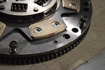 Close-up of automotive clutch disk and flywheel mechanism