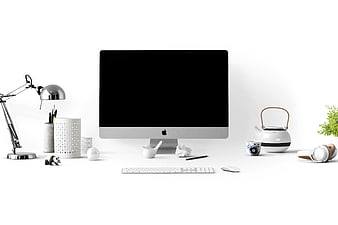 Minimalist White Workspace with Computer Monitor and Accessories