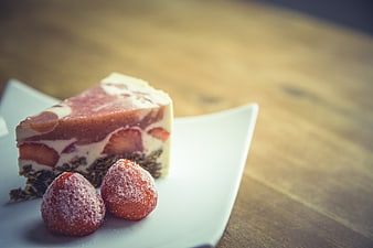 Strawberry Cheesecake Slice on White Plate