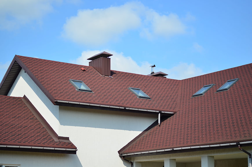 Red tiled roof of a modern house with skylights