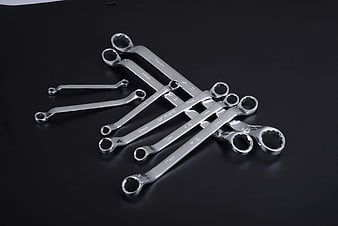 Set of Chrome Combination Wrenches on Black Background
