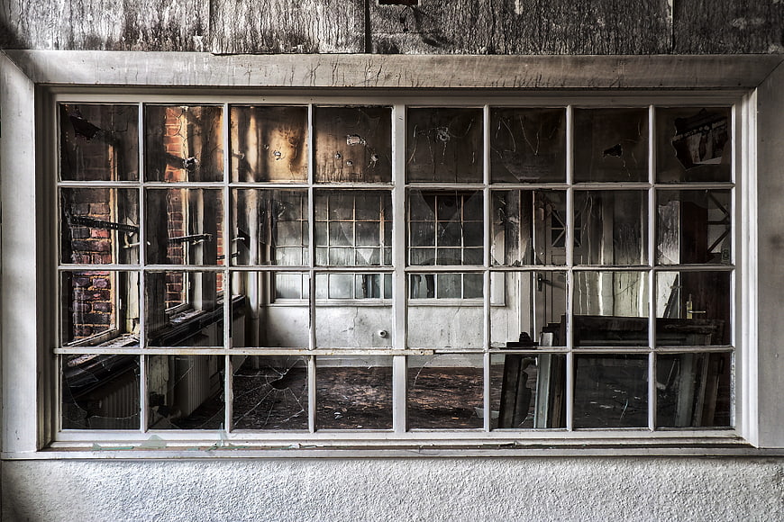 Broken Window of Abandoned Burnt Building Interior