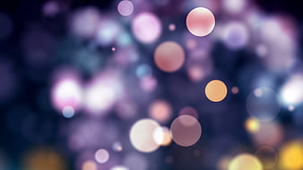 Abstract Bokeh Background with Soft Purple and Gold Lights