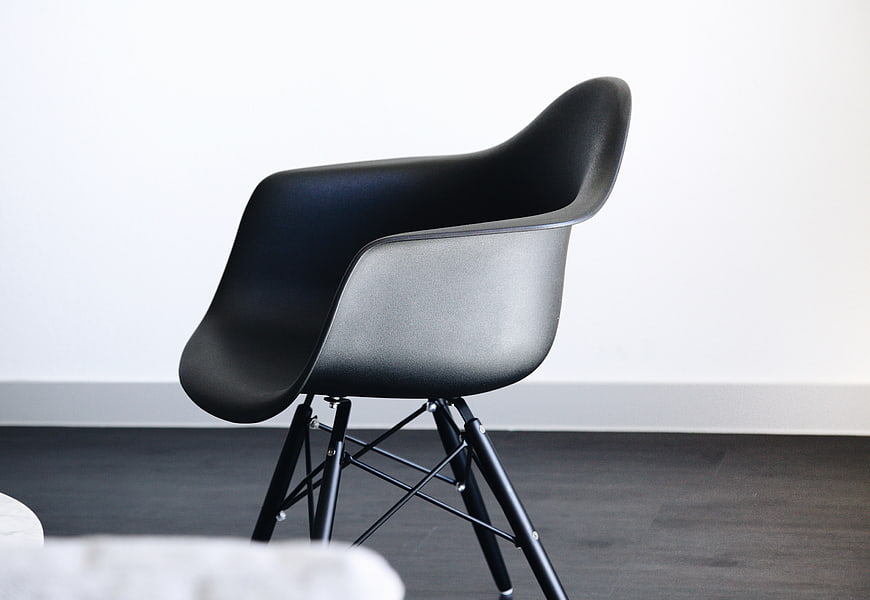 Modern Black Eames Style Chair in Minimalist Interior