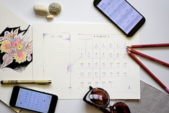 August Vacation Planning Flat Lay With Calendar, To-Do List, and Travel Accessories