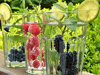 Refreshing Infused Water with Berries and Mint in Glasses
