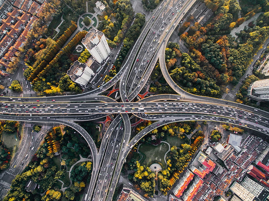 Aerial View of Busy Highway Interchange in Autumn City