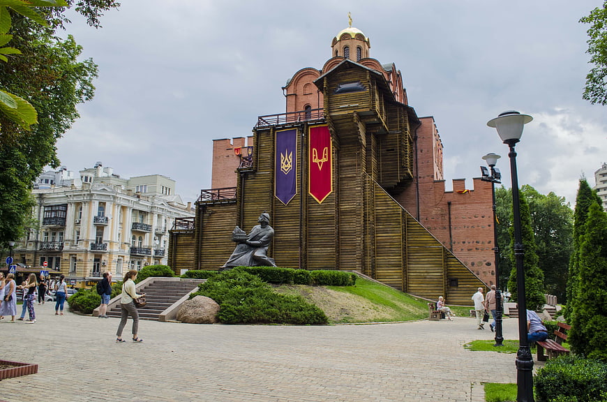Golden Gate of Kyiv with wooden reconstruction and statue