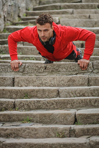 Athletic Man Doing Push-Ups on Stone Stairs