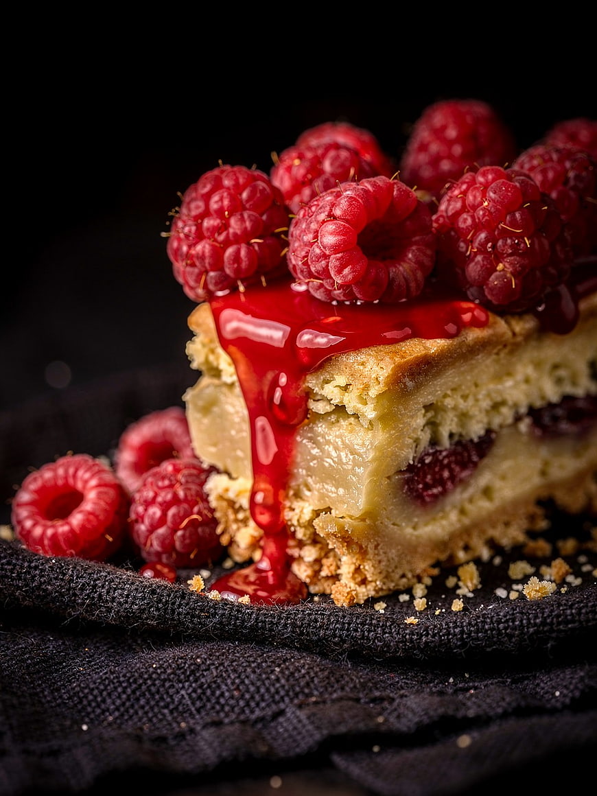 Close-up of Raspberry Cheesecake Slice with Glaze