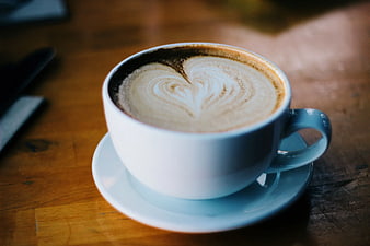 White Cup of Latte with Heart Foam Art on Wooden Table