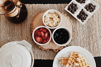 Overhead Flat Lay of Waffles, Fresh Berries, and Coffee on Rustic Table