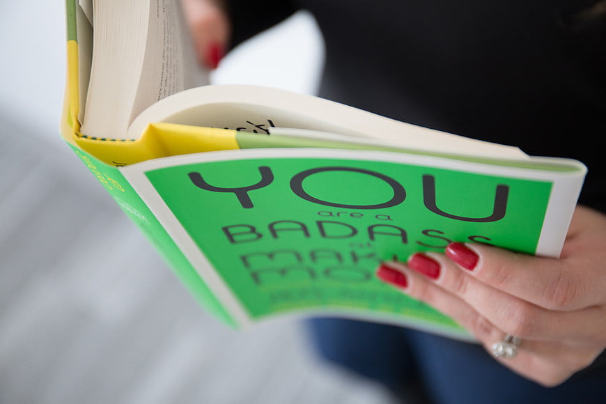 Close-up of Woman Reading Motivational Book