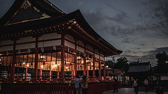 Traditional Japanese Shrine at Dusk with Lanterns