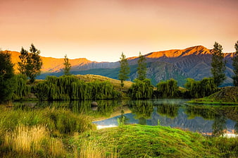 Serene Mountain Lake Landscape at Sunrise with Reflections