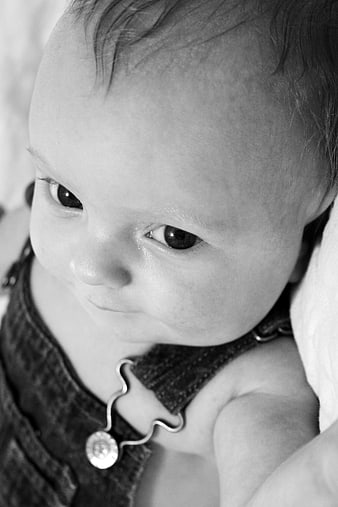 Close-up black and white portrait of a cute baby boy