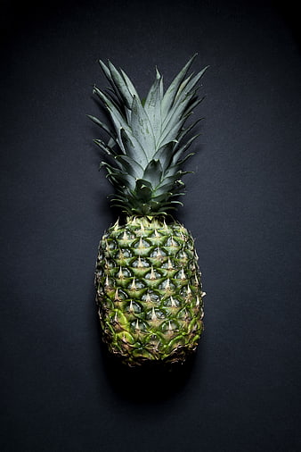 Whole Green Pineapple on Dark Background