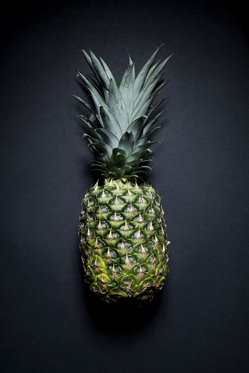 Whole Green Pineapple on Dark Background