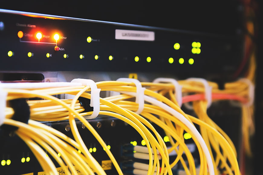 Close-up of yellow ethernet cables in server rack