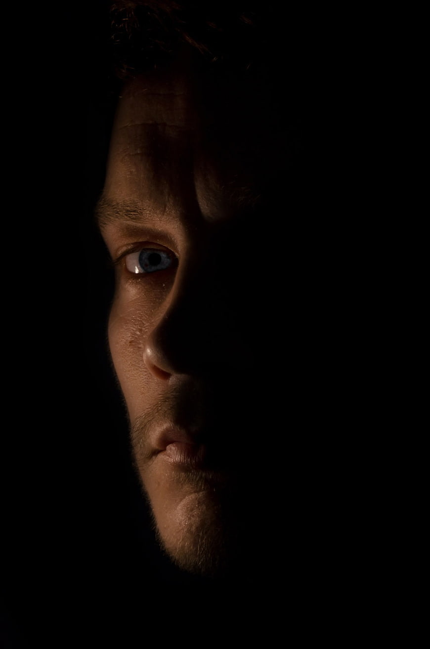 Dramatic Close-Up of Man's Face in Shadow