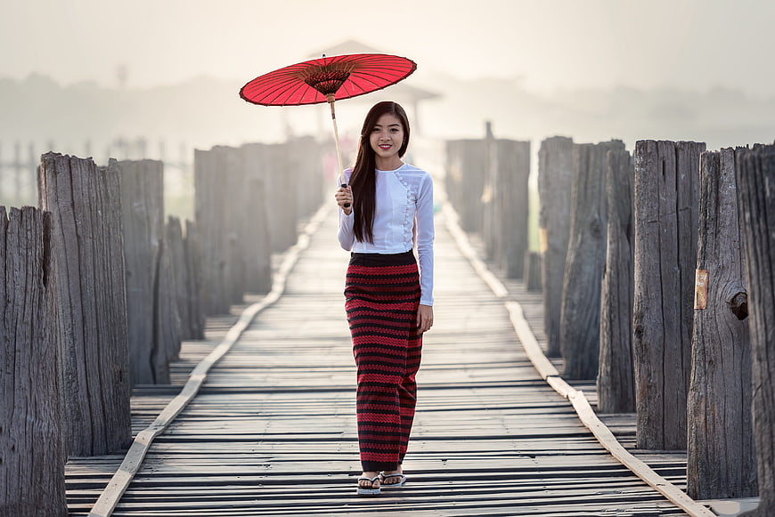 Asian Woman in Traditional Dress Walking on Wooden Bridge