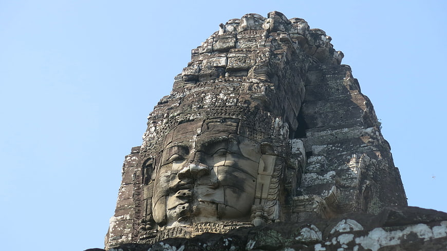 Ancient stone face sculpture at Bayon temple in Cambodia