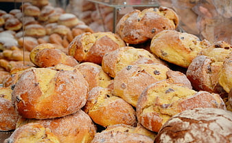 Close-Up Of Freshly Baked Raisin Bread Loaves With Sugar Dusting