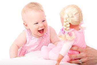 Laughing Baby Girl Playing With Pink Doll On White Background