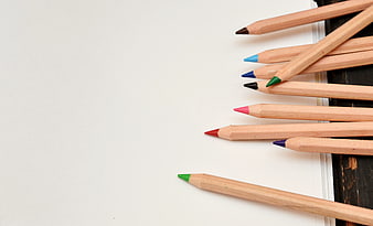 Colored Pencils on White Paper with Copyspace
