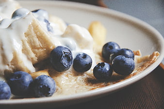 Close-up of pancakes with blueberries and yogurt