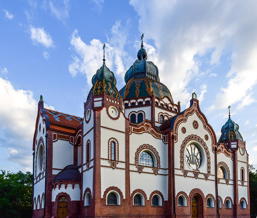 Colorful Orthodox Church with Blue Domes and Brick Facade