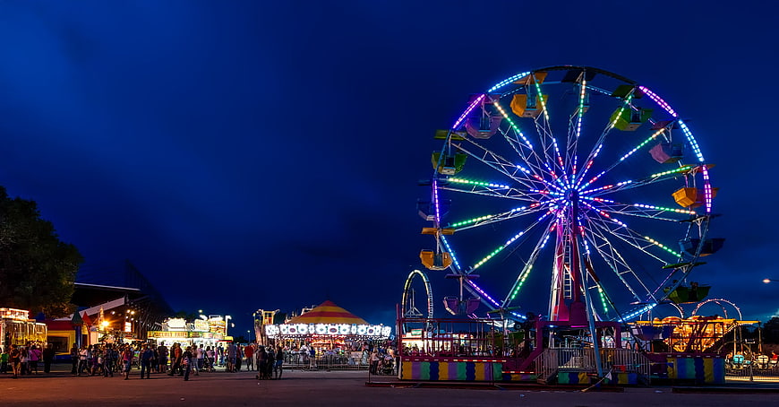 Illuminated Ferris Wheel At Night State Fair