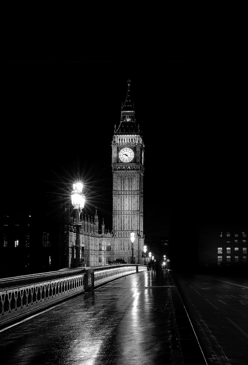 Black and white night view of Big Ben and Westminster Bridge