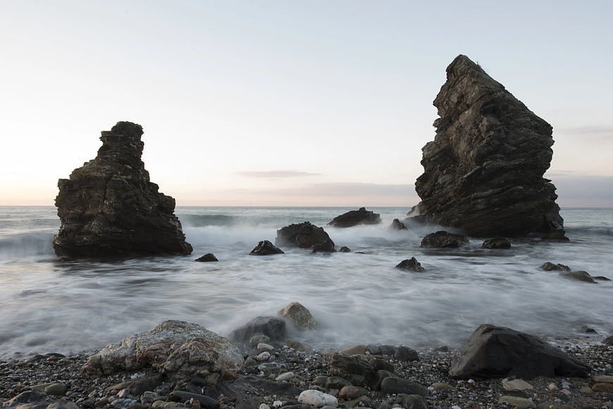 Dramatic Sea Stacks on Rocky Shore at Sunset