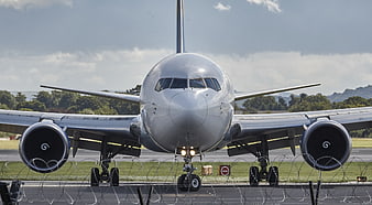 Front View of Silver Passenger Jet on Runway