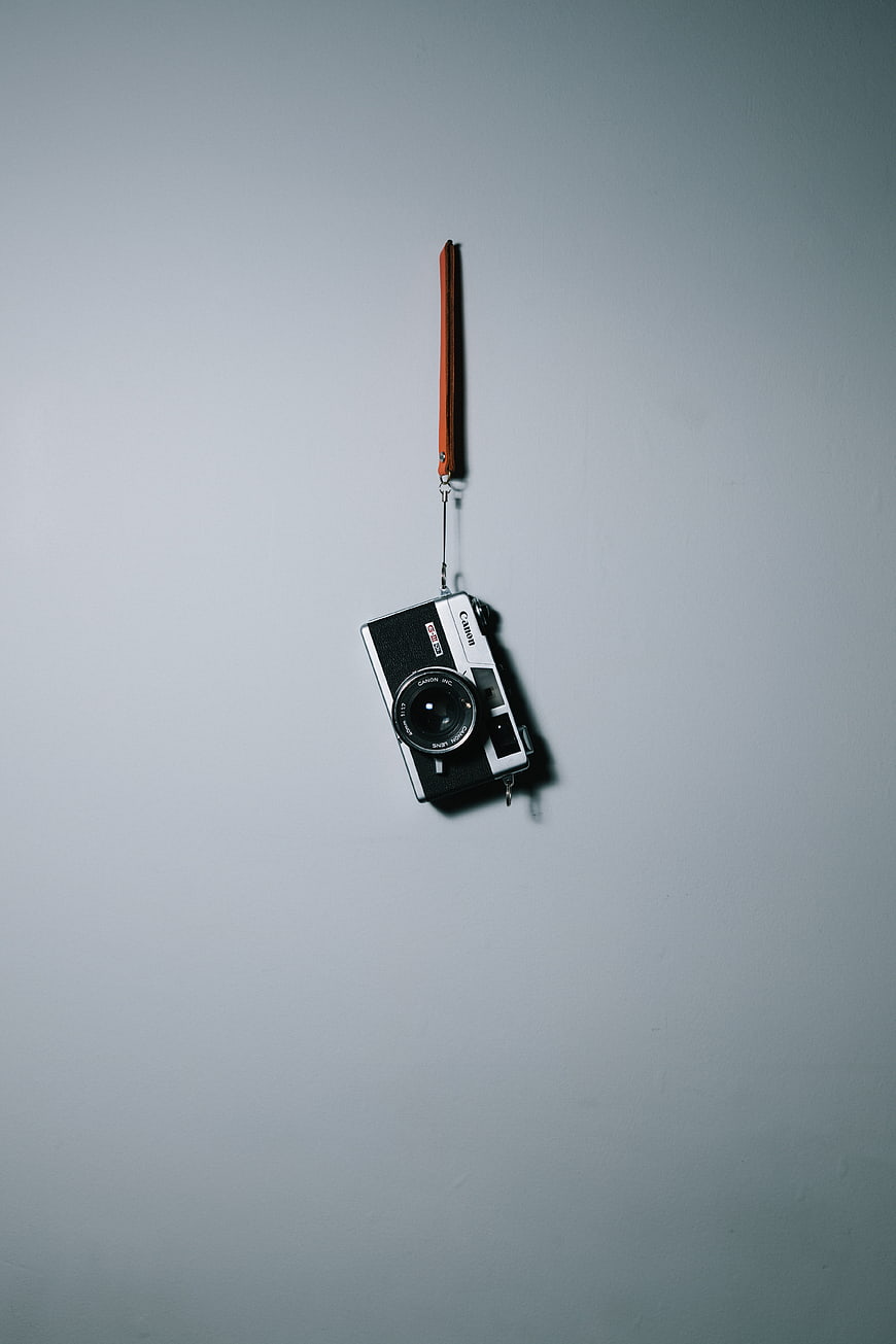 Vintage Canon Film Camera Hanging on Wall