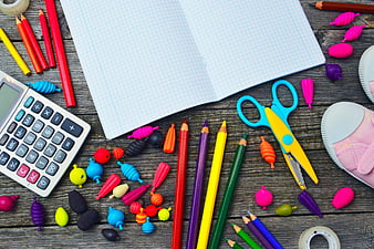 Colorful School Supplies Flat Lay on Rustic Wooden Desk