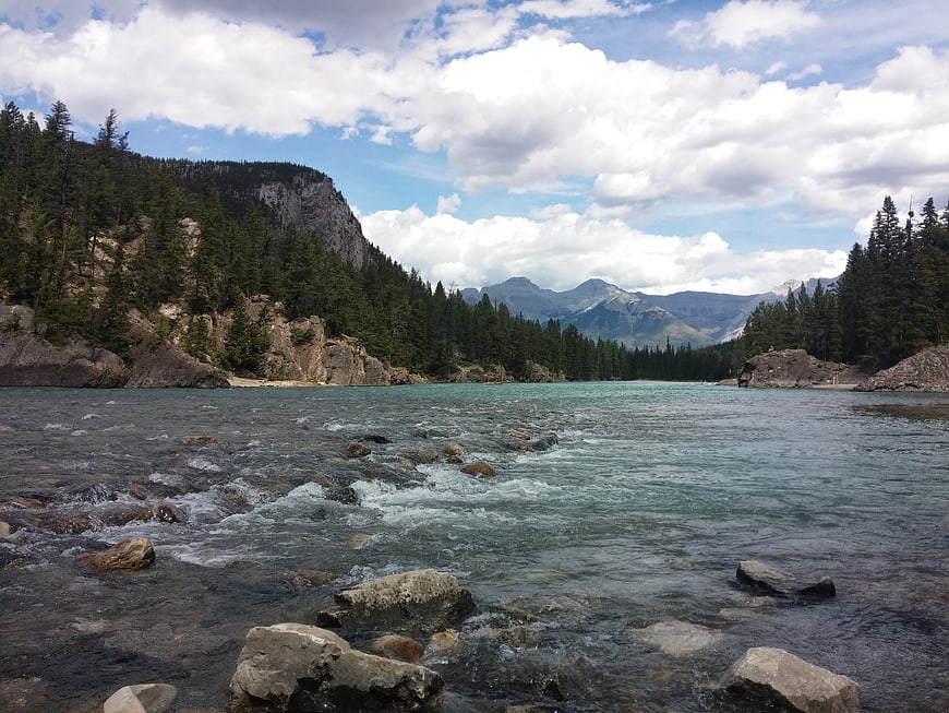Turquoise glacial river flowing through Banff National Park mountains