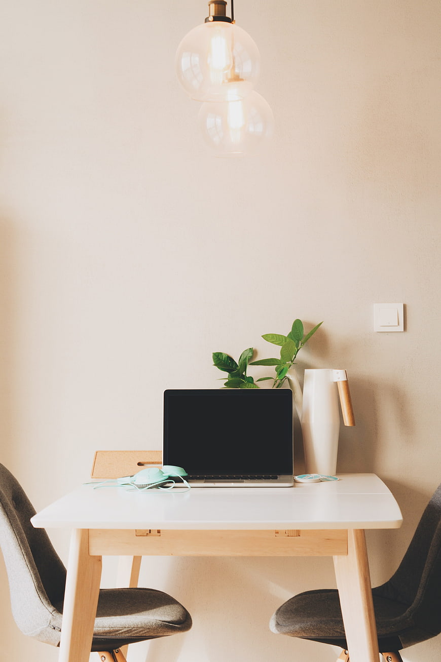 Minimalist Home Office Desk with Laptop and Plant