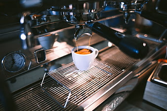 Espresso Pouring from Professional Coffee Machine into White Cup