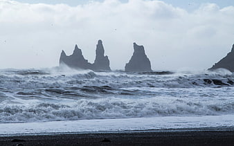 Dramatic Ocean Waves Crashing Near Black Sand Beach with Sea Stacks