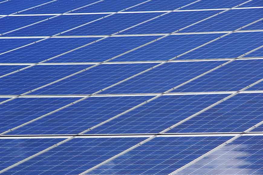 Close-up of Blue Solar Panels with Diagonal Grid Pattern