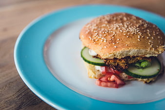 Close-up of a homemade veggie burger on a blue plate