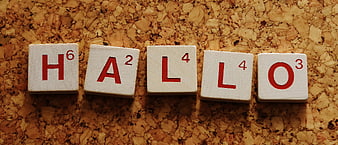 Scrabble Tiles Spelling Hallo on Cork Board