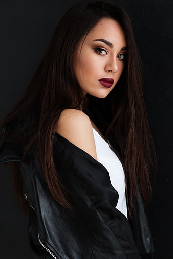 Portrait of woman with dark lipstick and leather jacket