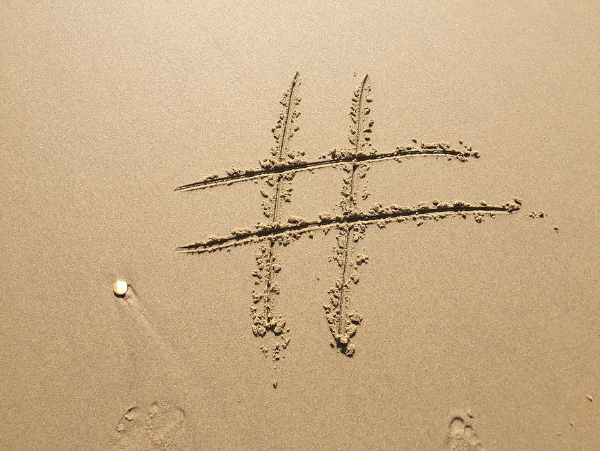 Hashtag Symbol Drawn in Sand on Beach