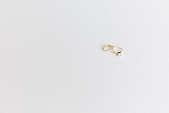 Minimalist Gold Wedding Rings on White Background