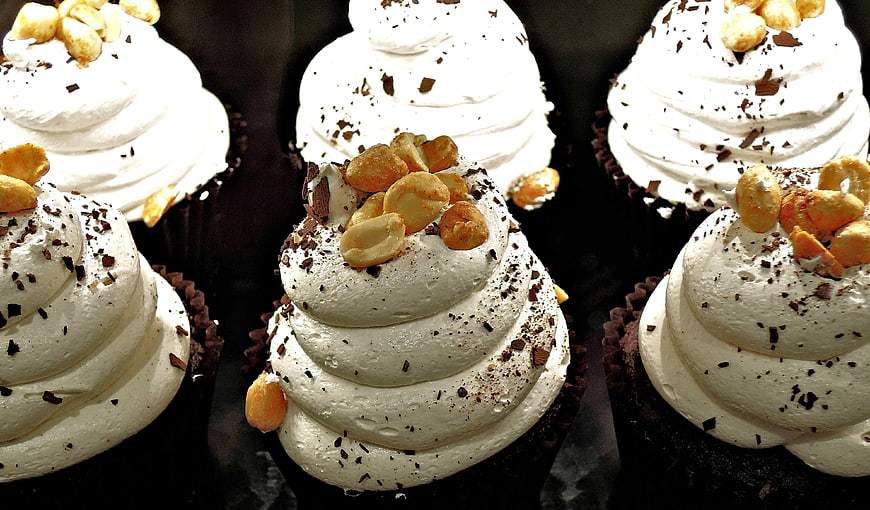 Chocolate Cupcakes with White Frosting and Peanuts