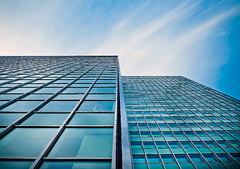 Low Angle View of Modern Glass Skyscrapers Against Blue Sky